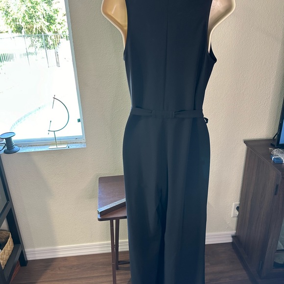 cupcakes and cashmere Black jumpsuit. Wide leg, wrap top. Great for any event! - Picture 2 of 7